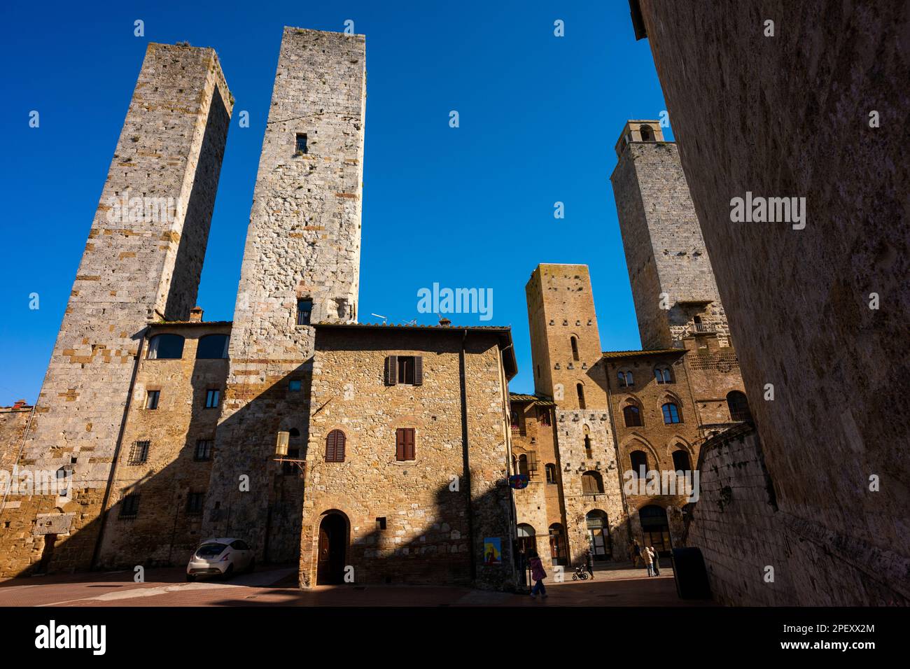 The medieval walled hill town of San Gimignano, a popularedestination for tourists in Tuscany, Italy. A UNESCO world heritage site. Stock Photo