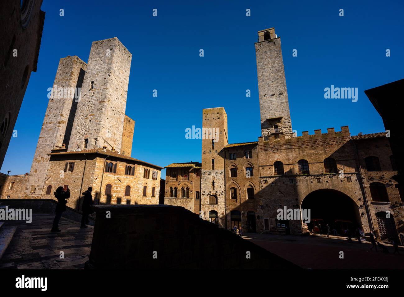 The medieval walled hill town of San Gimignano, a popularedestination for tourists in Tuscany, Italy. A UNESCO world heritage site. Stock Photo
