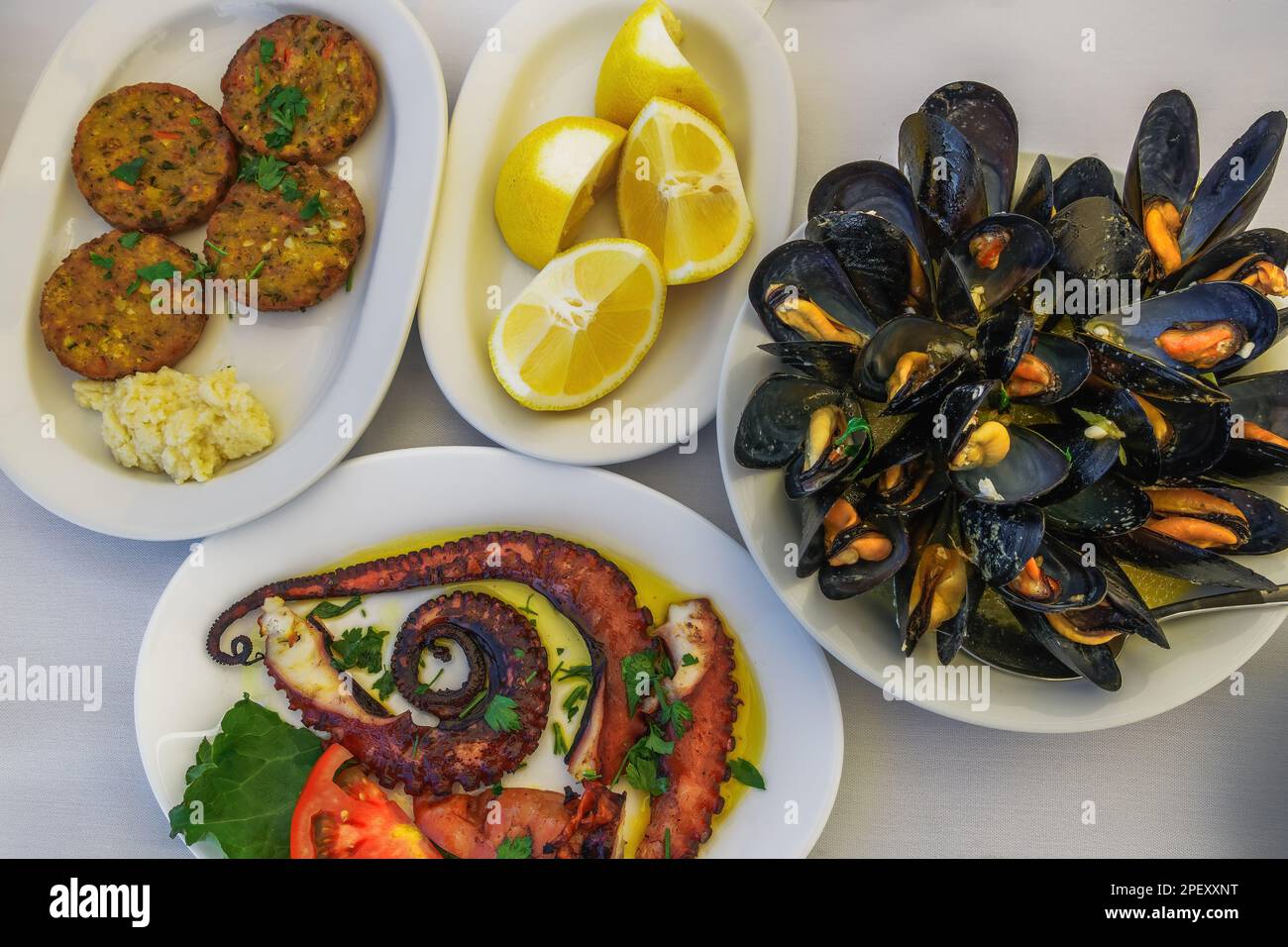 Greek tavern food closeup top view with mussels with clams, fried