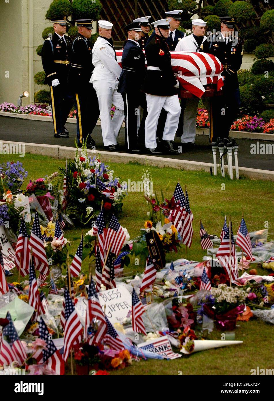 With hundreds of flags, flowers and messages in the foreground