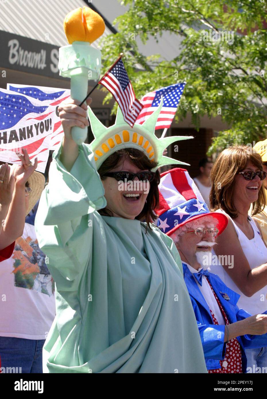 Holly Smith wears a Statue of Liberty costume Saturday June 5, 2004 as she stands with her mom