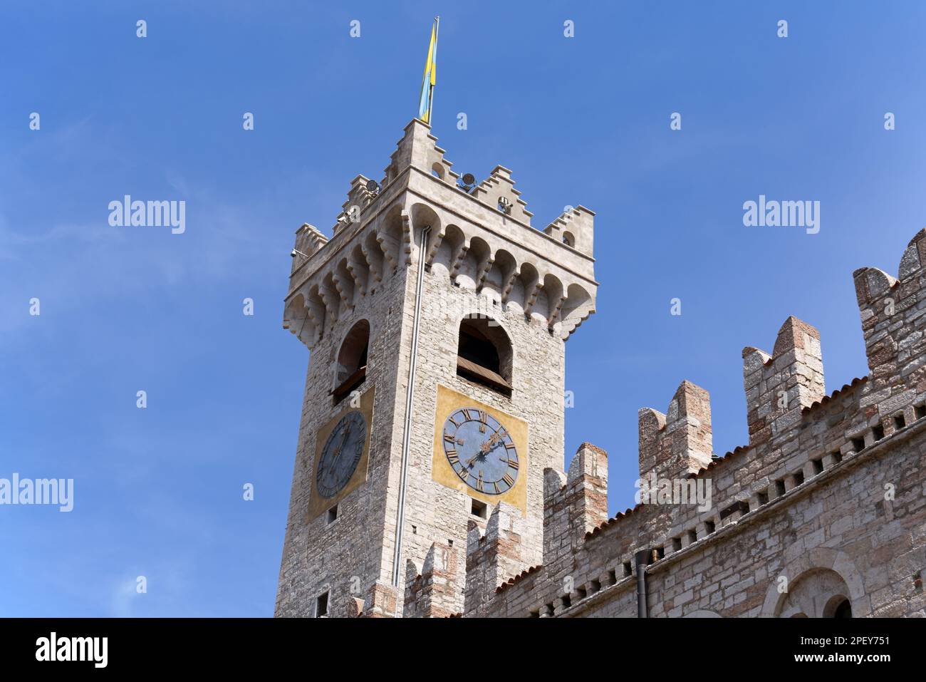 The civic tower of Trento stands in the main square of the town, Piazza Duomo. This 43 metres high limestone tower was built in 1150 to defend the tow Stock Photo