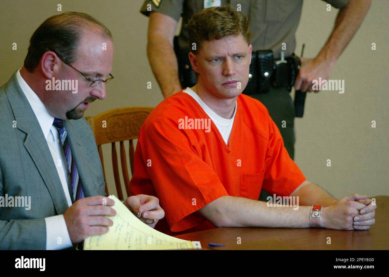 Brett Zartman, right, sits with his attorney, Darin Harmon, during his