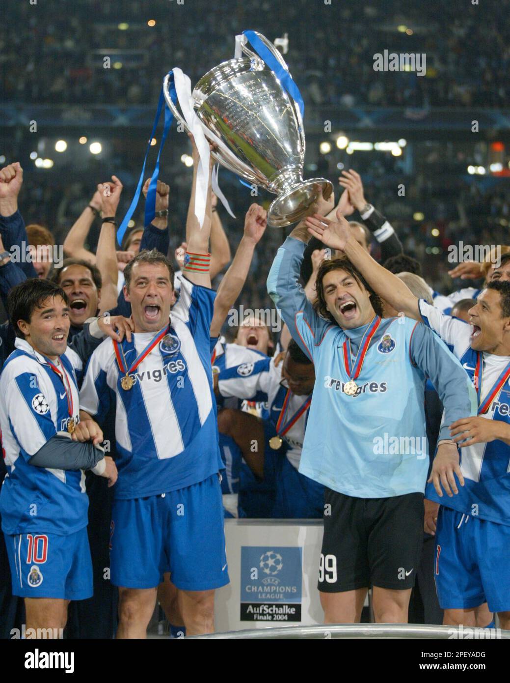 Porto players celebrate as they lift the trophy after beating