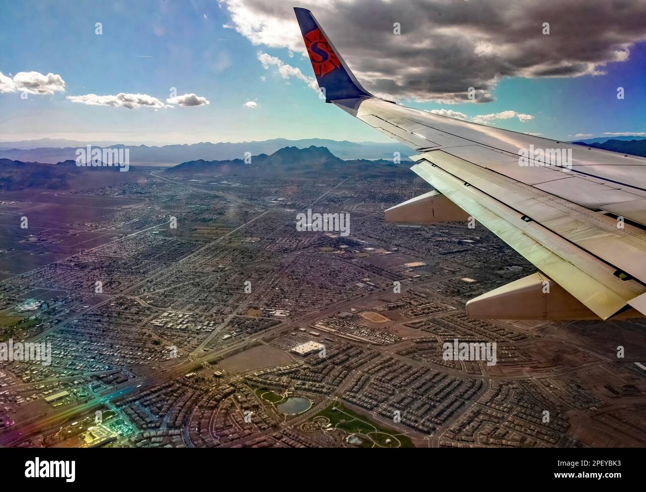 Sun Country Airlines plane flight flying over the city of Las Vegas