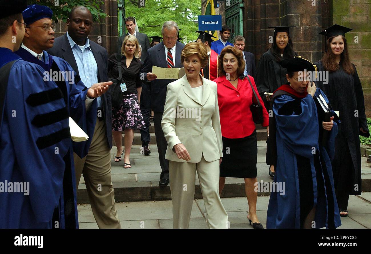 First lady Laura Bush, in white suit, leaves the Old Campus at Yale University in New Haven