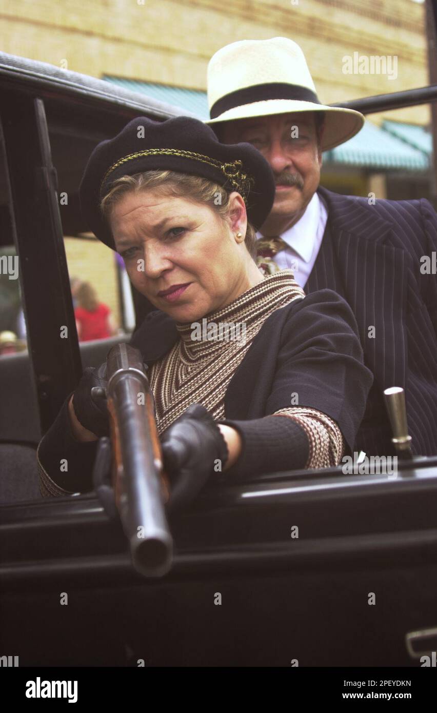 Michelle Groves, left, and Roger Groves dress as Bonnie Parker and