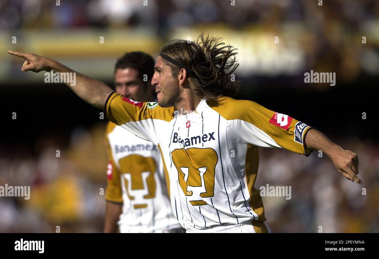 Pumas soccer player Bruno Marioni from Argentina celebrates after scoring a  goal against Monterreys team at the University stadium in Mexico City  Saturday May.15, 2004 during their Mexican first division game. Bruno