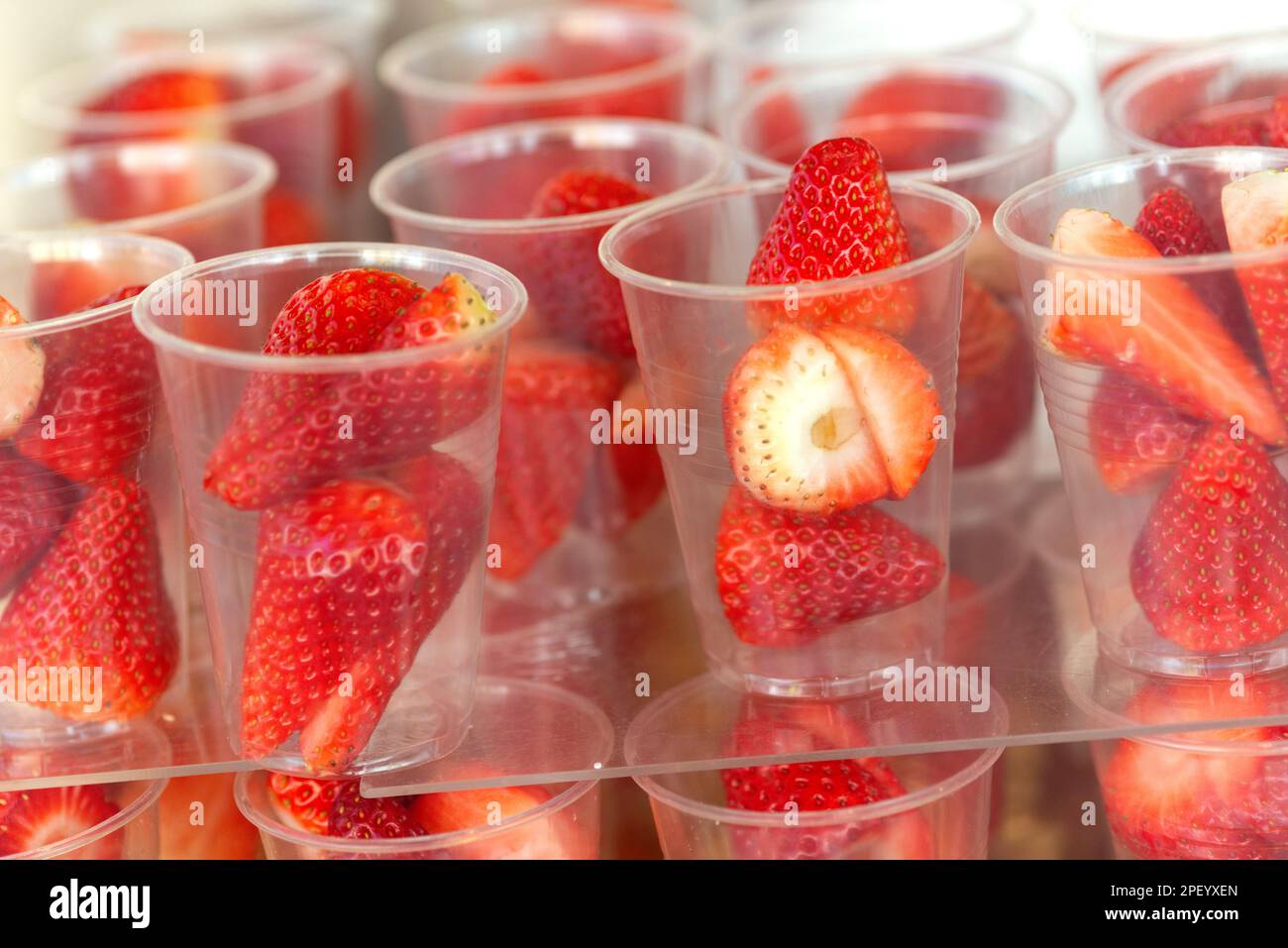 Plastic Glasses With Strawberries Stock Photo Alamy