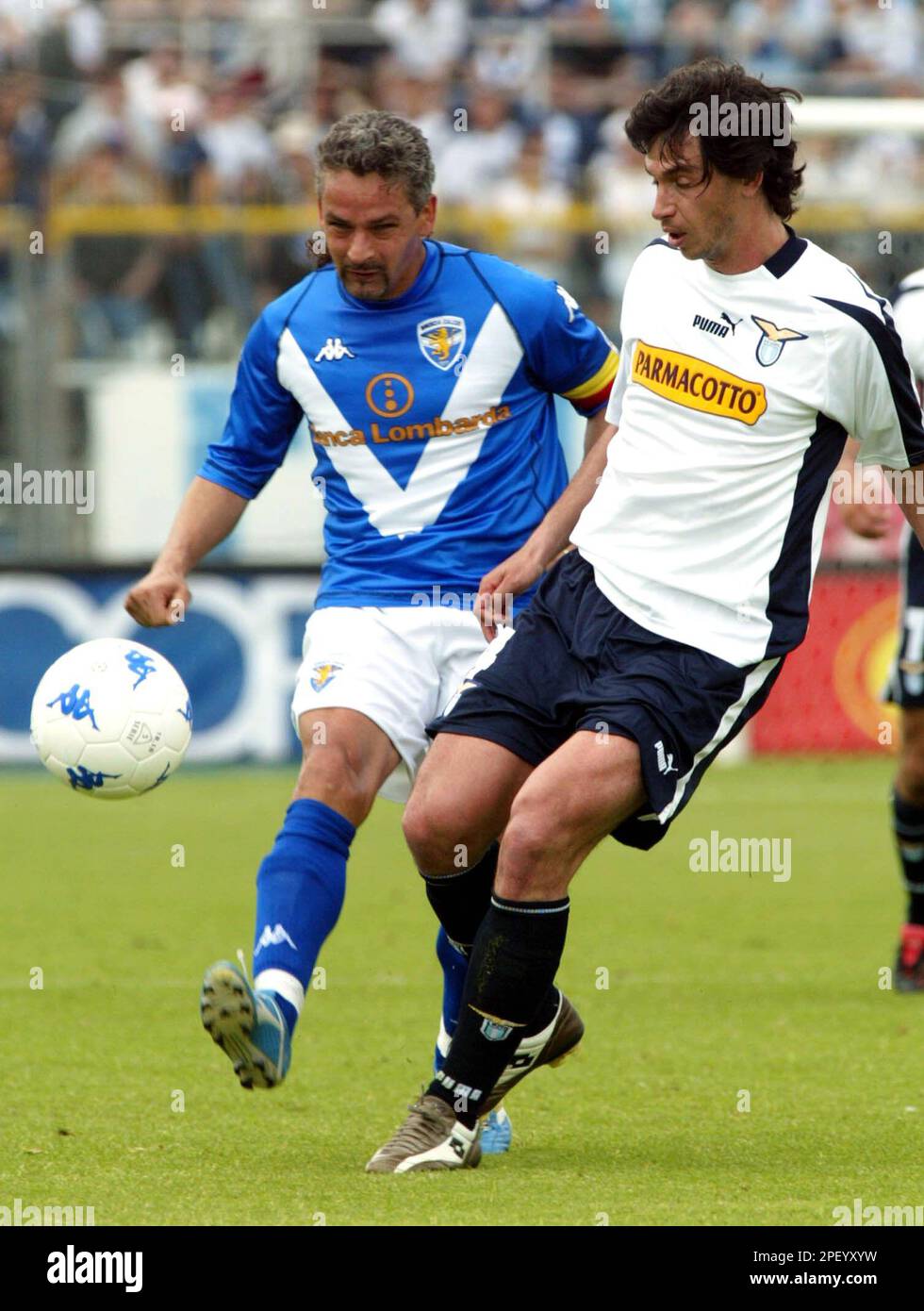 Brescia soccer star Roberto Baggio, left, is challenged by Brescia soccer star Roberto Baggio, left, is challenged by