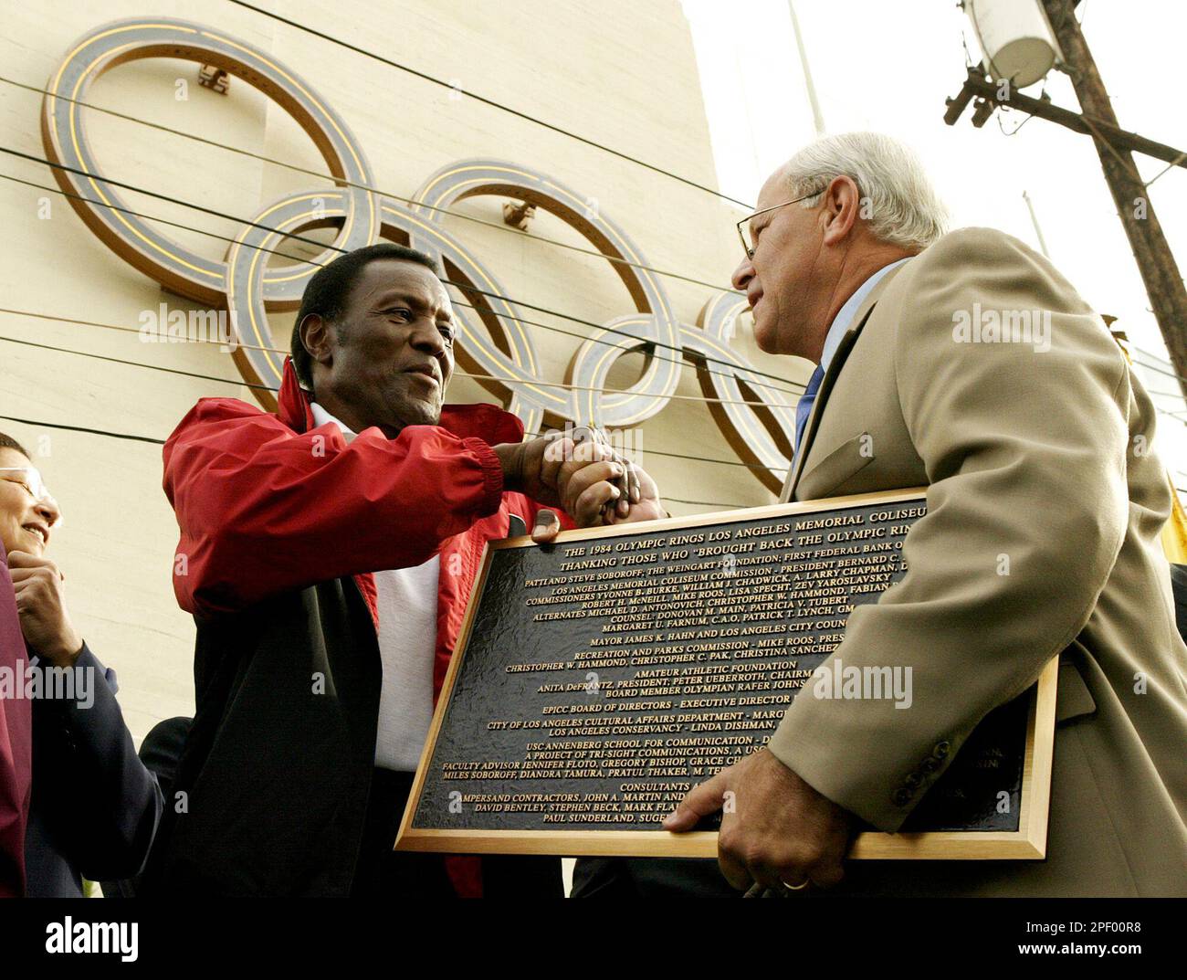 Olympic Hall of Famer Rafer Johnson, left, who originally lit the ...