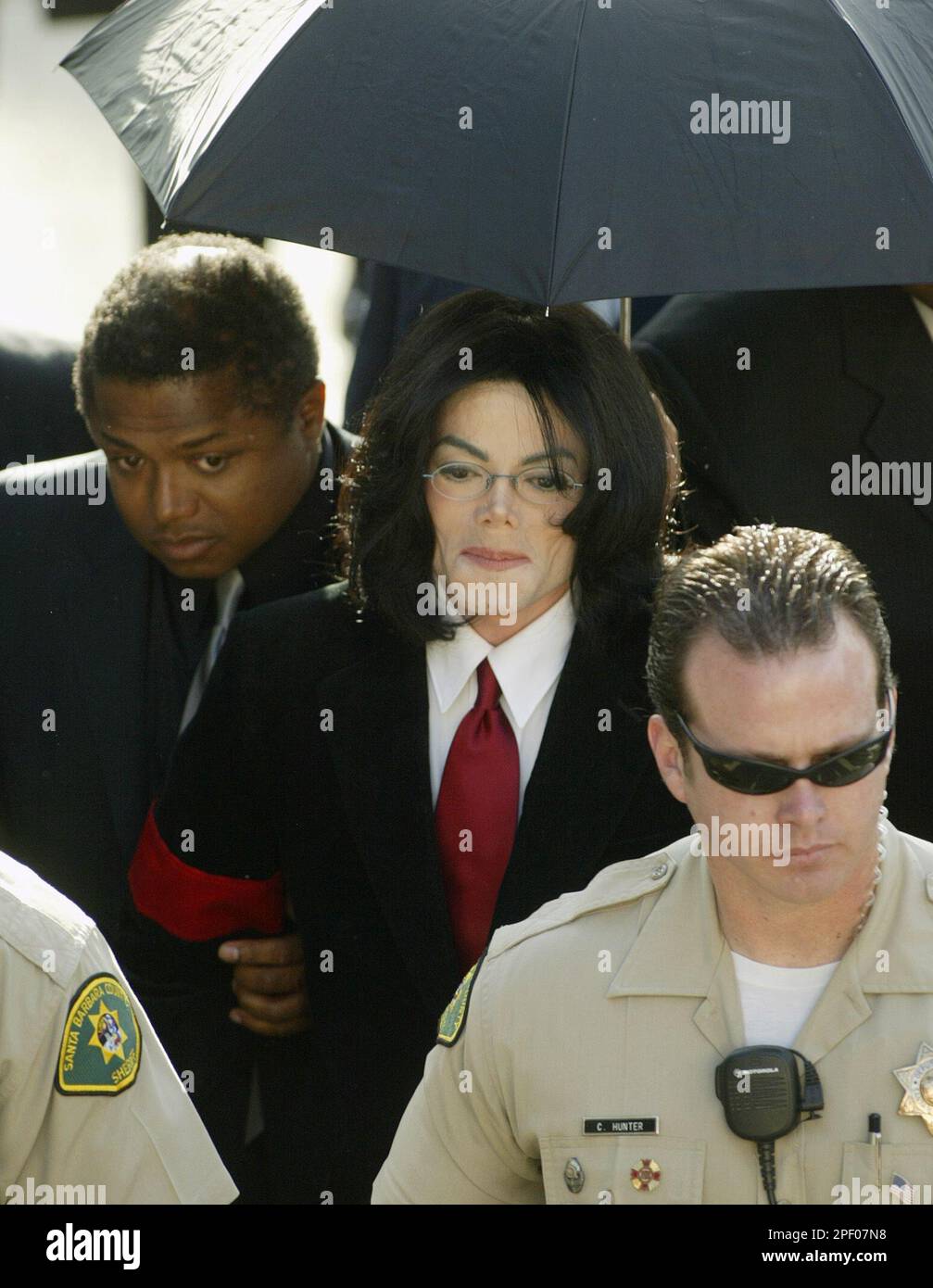 Michael Jackson arrives with his brother Randy, left, for his expected ...