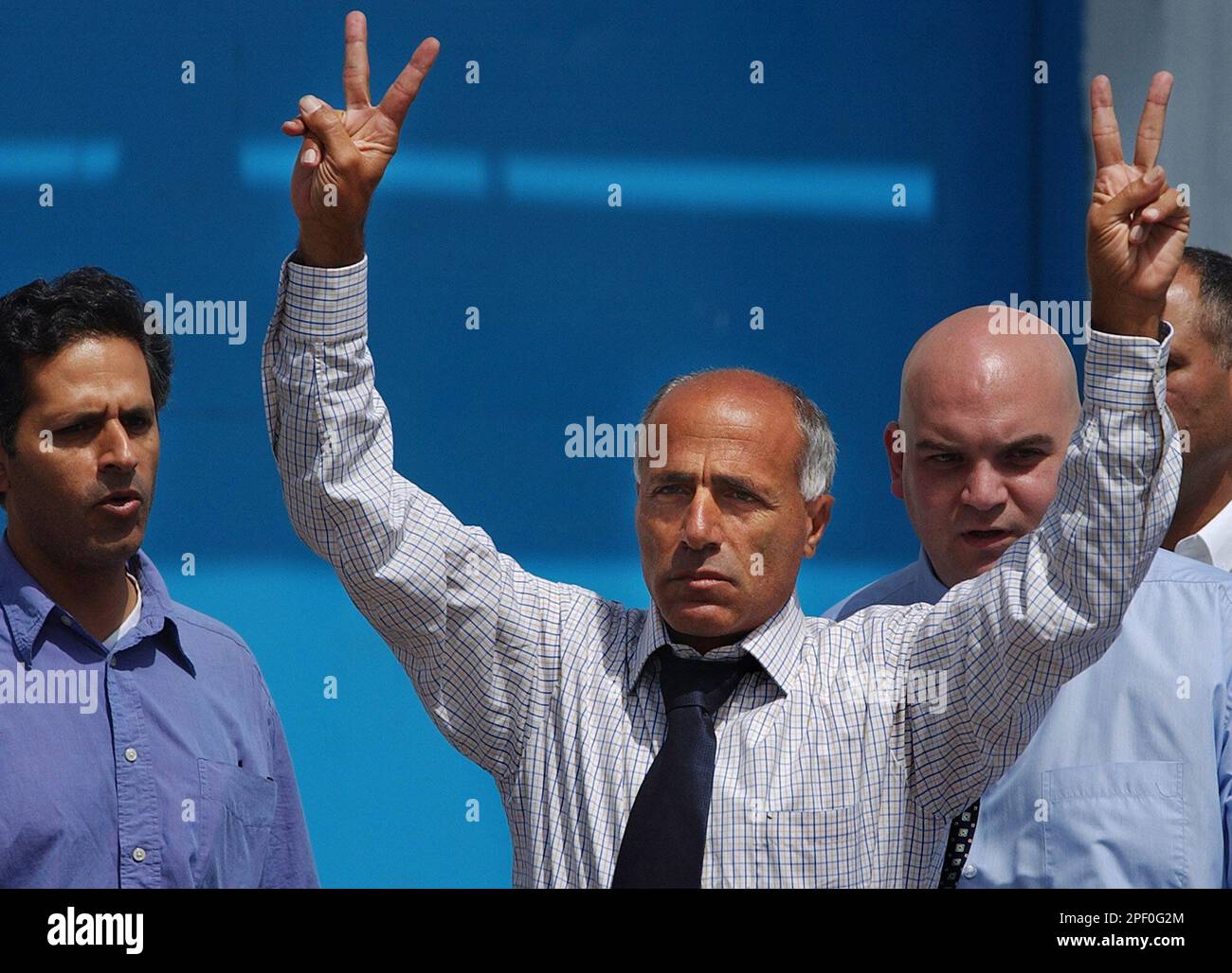 Israeli nuclear whistleblower Mordechai Vanunu gestures as he stands next to his brother Mail, left, outside Shikma Prison following his release in the coastal city of Ashkelon, Israel Wednesday, April 21, 2004. (AP Photo/Ariel Schalit) Stock Photo
