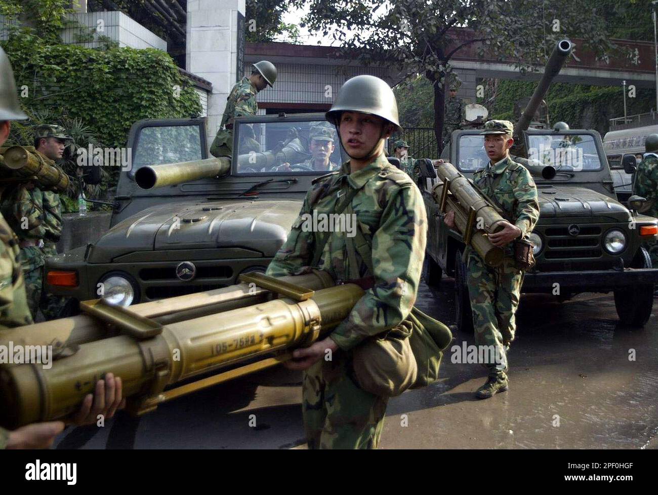 Chinese People's Liberation Army (PLA) soldiers transfer ammunition before attempting to destroy