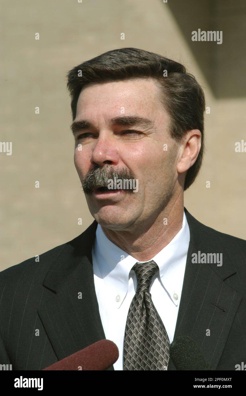 Cecil Stack, a retired sergeant major, reads a statement from his ...