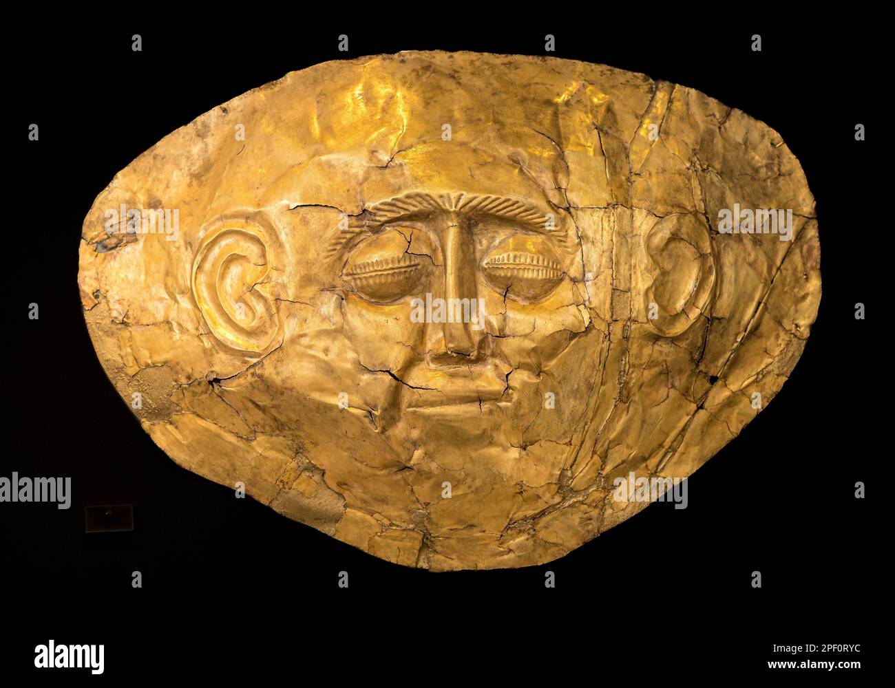 A 16th Century BC,  gold, funerary mask from grave IV of grave circle A at Ancient Mycenae, Peloponnese, Greece. Stock Photo