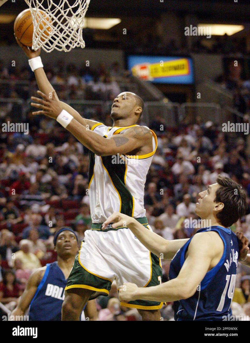 Seattle SuperSonics' Rashard Lewis holds up his shoes before throwing them  into the cheering crowd following the Sonics' 97-72 win over the New  Orleans Hornets on Friday, April 15, 2005, in Seattle.