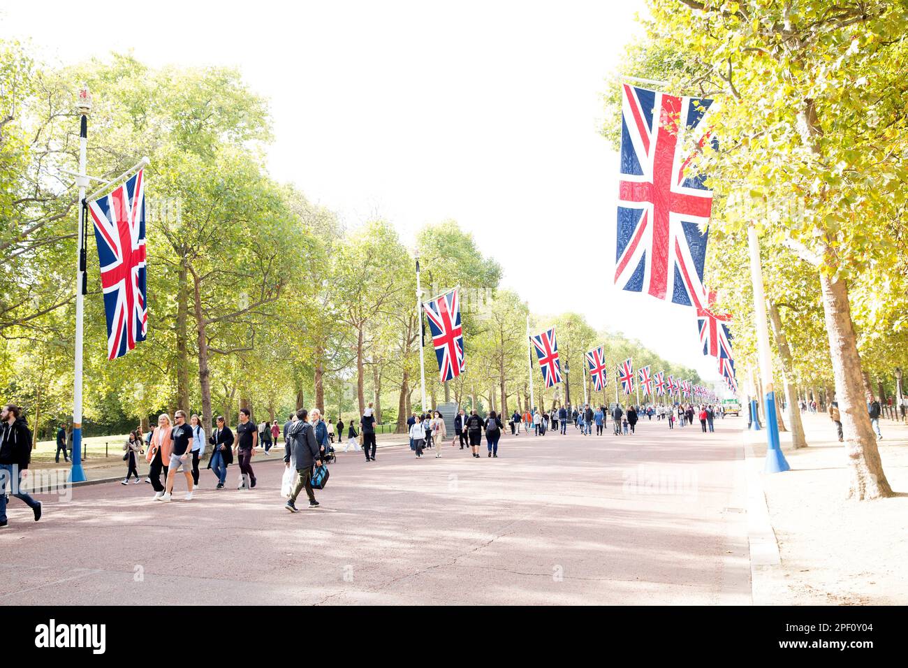 People walk on The Mall in central London as people gather around Buckingham Palace on the first Saturday since the funeral of Queen Elizabeth II. Stock Photo