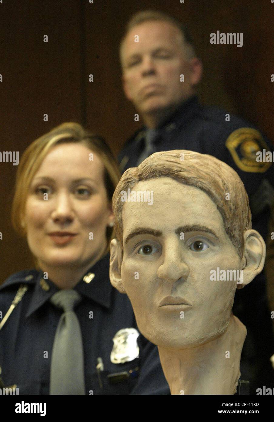 The reconstructed face of Shawn Patrick Raymond, right, is shown with