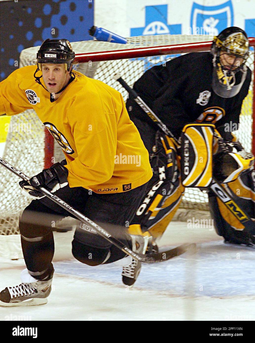 Boston Bruins captain Joe Thornton, left, who missed the final two games of the regular season due to an injury, practices at the Fleet Center in Boston, Tuesday, April, 6, 2004, as Boston Bruins captain Joe Thornton, left, who missed the final two games of the regular season due to an injury, practices at the Fleet Center in Boston, Tuesday, April, 6, 2004, as