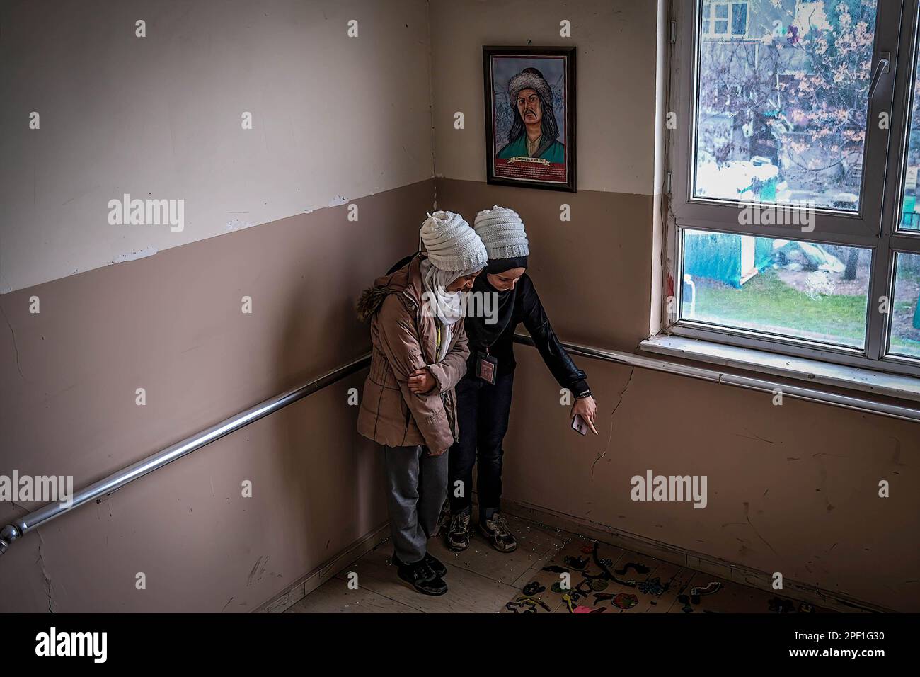 Kahramanmara, Turkey. 15th Mar, 2023. Meryem and Muna are seen inside SÃ¼mer Secondary School that was partly damaged by the earthquake. Meryem and Muna (earthquake victims) visit their school that was damaged in Kahramanmara?, Turkey. (Credit Image: © Murat Kocabas/SOPA Images via ZUMA Press Wire) EDITORIAL USAGE ONLY! Not for Commercial USAGE! Stock Photo