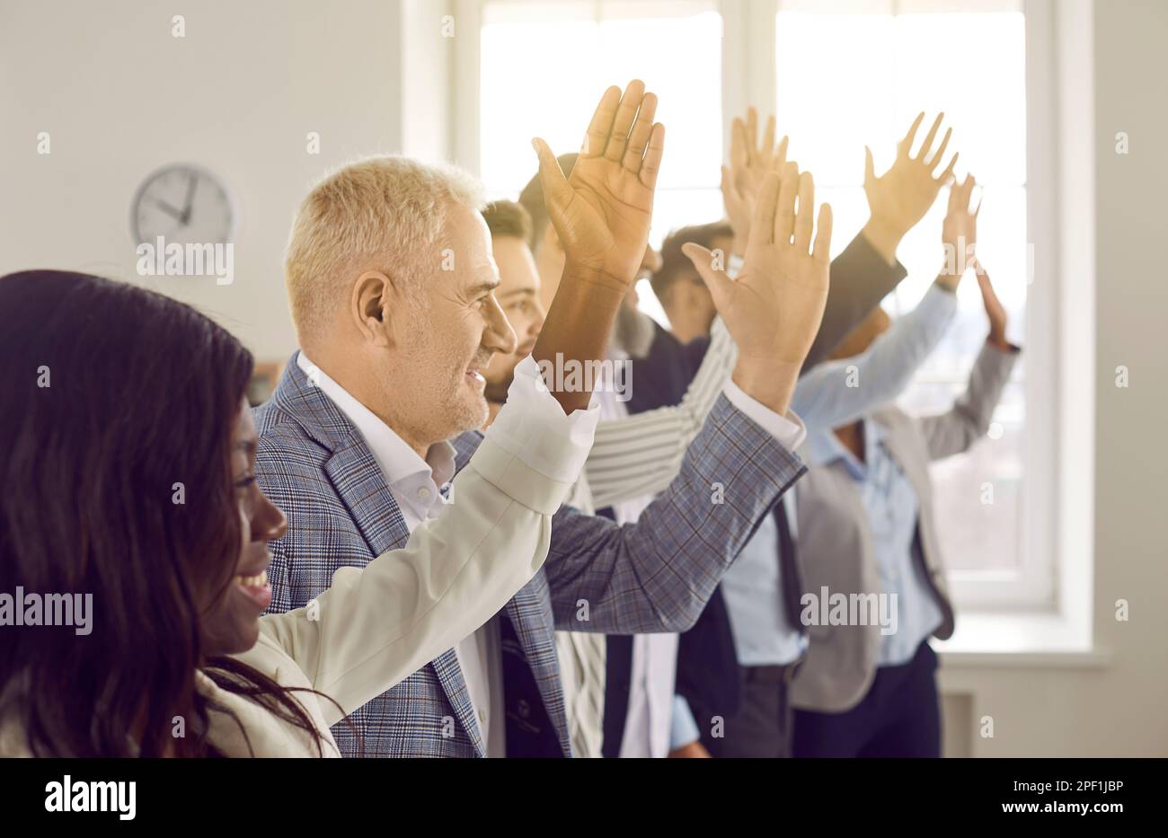 Raising hands voting hi-res stock photography and images - Alamy