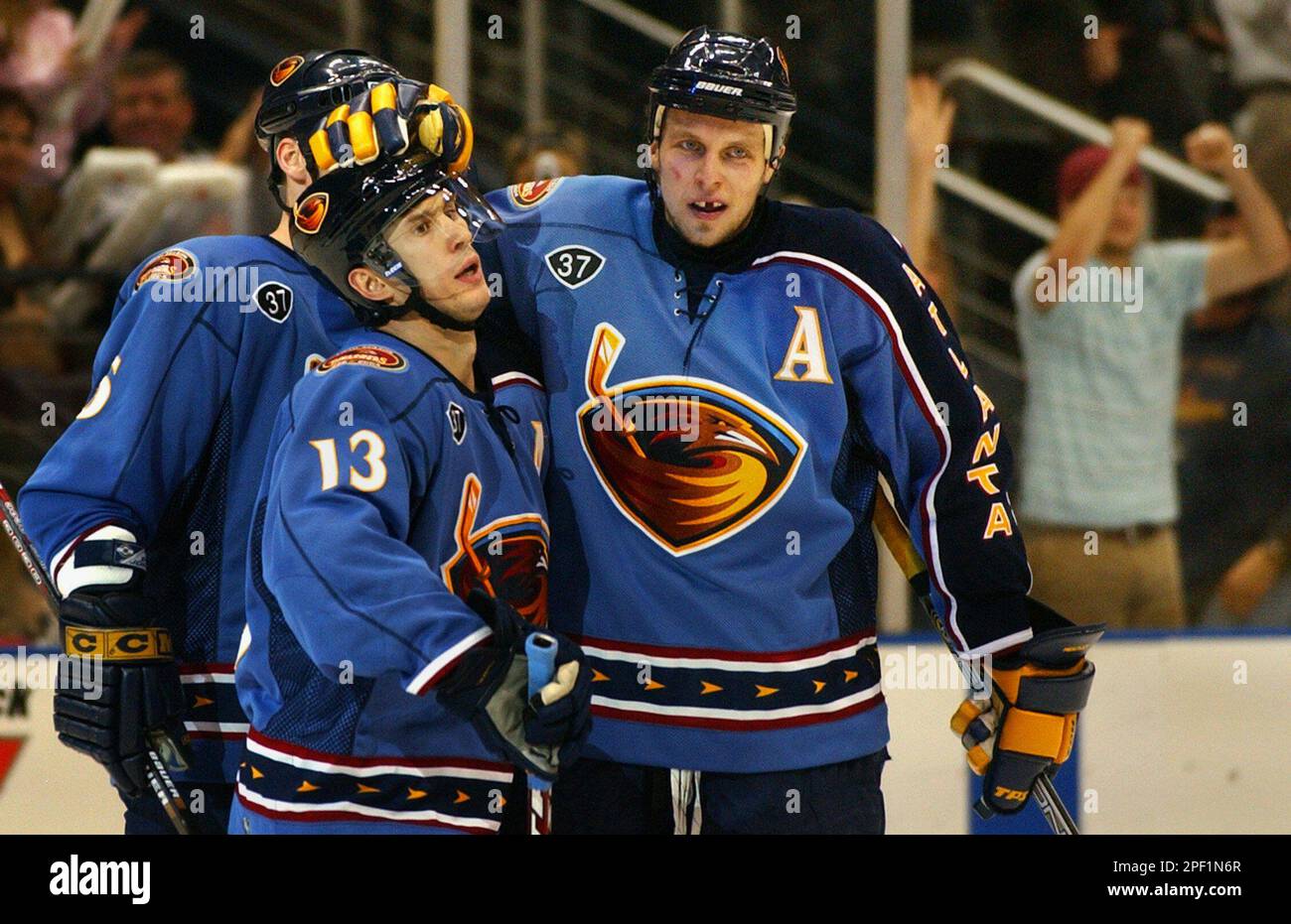 Atlanta Thrashers Dany Heatley, right, sends Calgary Flames Josh Green to  the ice during first period NHL action in Calgary on Tuesday, Feb. 10,  2004. This was Heatley's first time playing in