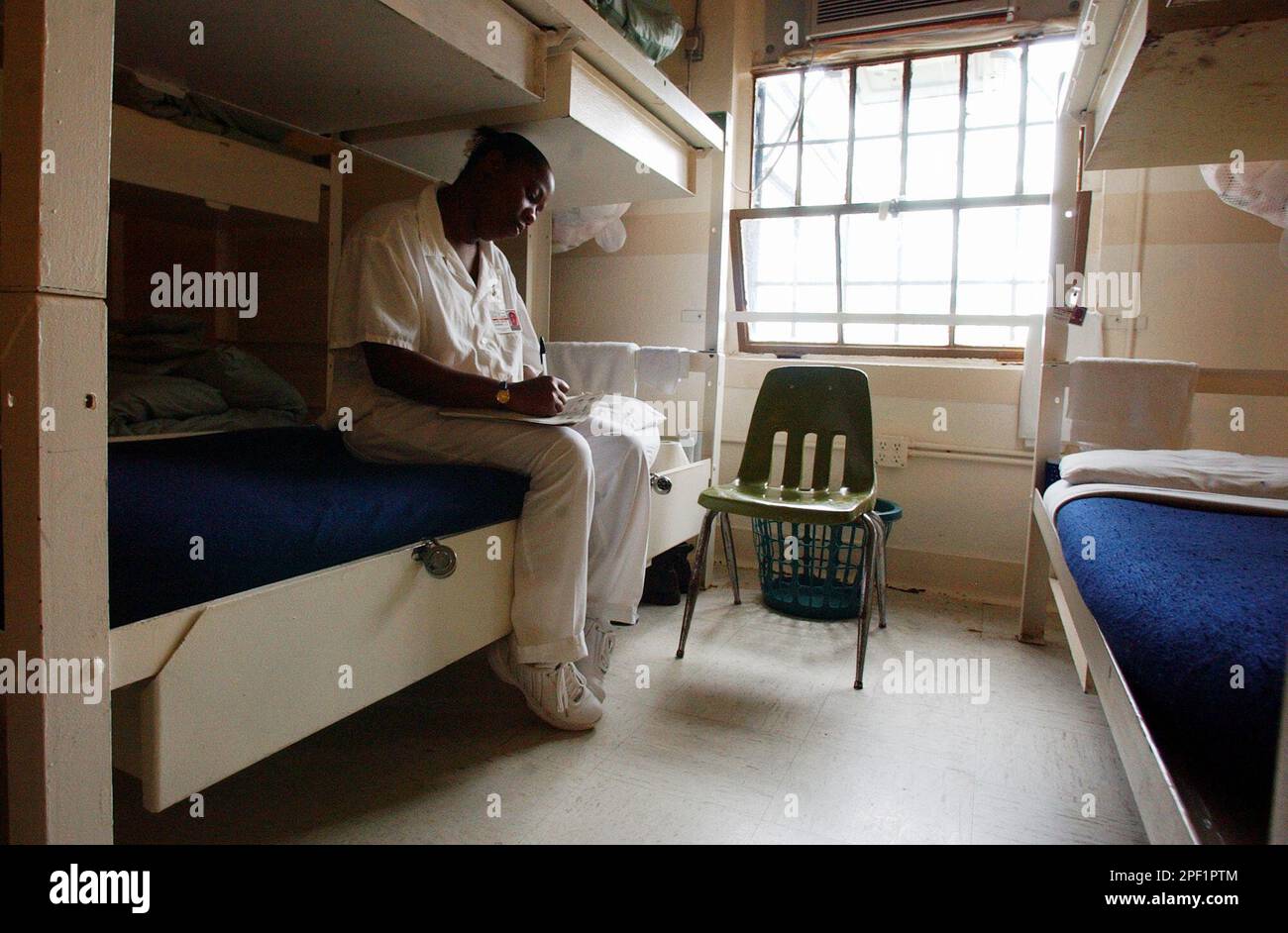 Inmate Takiya Radford sits on her bunk in Dorm 8 at Tutwiler Prison in
