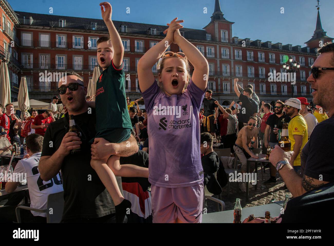 Madrid, Spain, 15/03/2023, The Plaza Mayor in Madrid and the surroundings of the Santiago Bernabeu stadium live a great football atmosphere with fans of Liverpool and Real Madrid who will meet tonight in the round of 16 of the Champions League. The day of this Wednesday is lived with fewer incidents due to the decrease in the number of English fans compared to other visits, although there is no shortage of songs between countless beers in the Plaza Mayor and its surroundings. The Reds, as fans of the English team, are traditionally known, to adhere to this maxim to the letter. On each trip, th Stock Photo