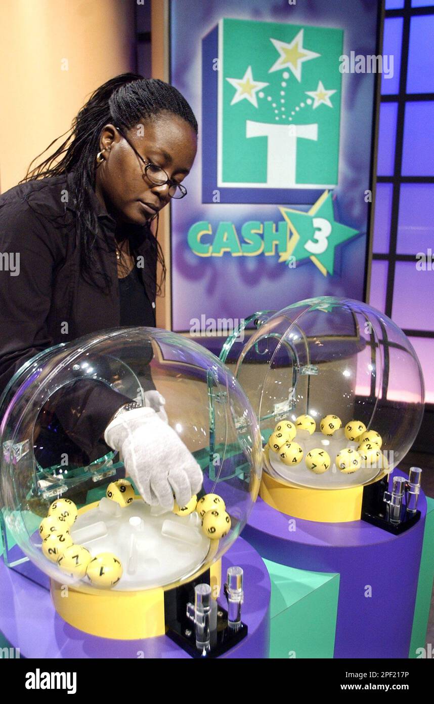 https://c8.alamy.com/comp/2PF217P/advance-for-sunday-feb-29-tomesia-day-resets-the-numbered-ping-pong-balls-during-rehearsal-for-the-tennessee-lottery-cash-3-drawing-at-a-tv-studio-in-nashville-tenn-thursday-feb-26-2004-the-televised-drawings-with-a-maximum-payoff-of-500-begin-monday-march-1-ap-photomark-humphrey-2PF217P.jpg