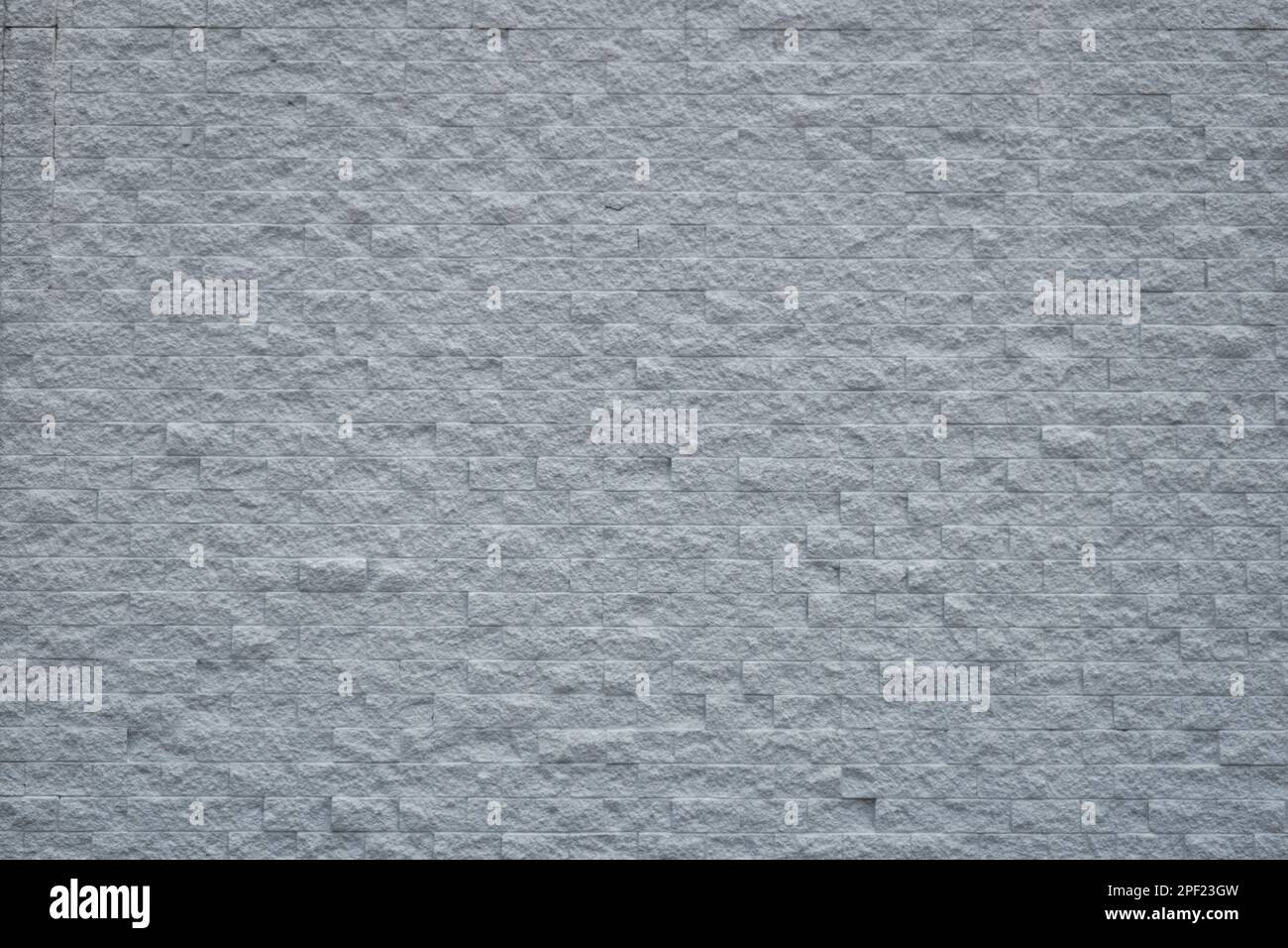 Large light gray brick wall rough textured background Stock Photo - Alamy