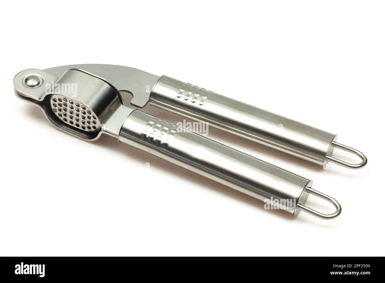Metallic shiny garlic press crusher tool isolated on white background. Stainless kitchen utensil