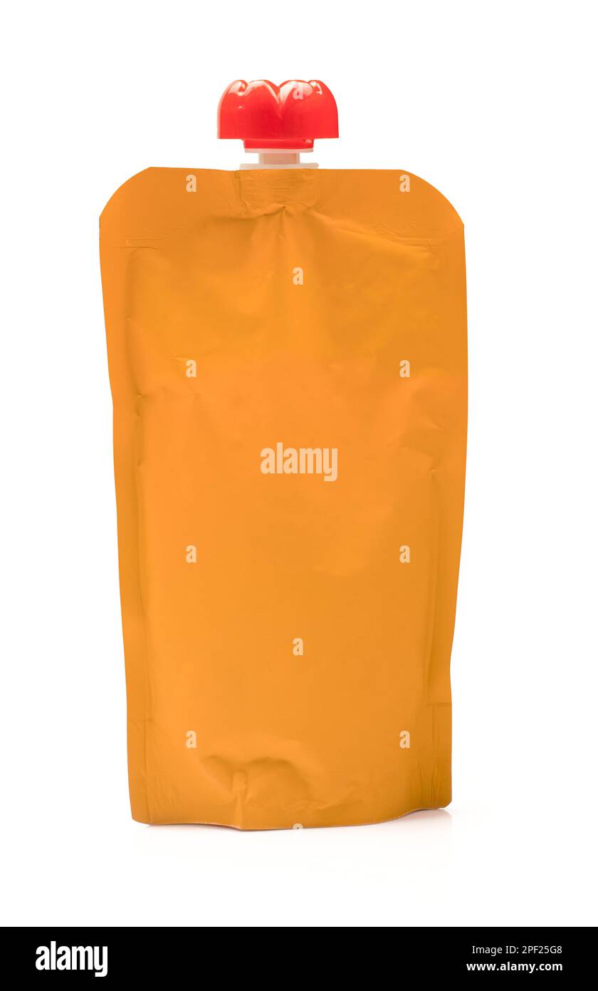Single blank orange colored puree bag. Liquid container packaging isolated on white background Stock Photo