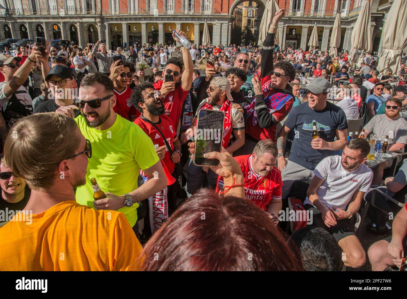 March 15, 2023, Madrid, Madrid, Spain: The Plaza Mayor in Madrid and the surroundings of the Santiago Bernabeu stadium live a great football atmosphere with fans of Liverpool and Real Madrid who will meet tonight in the round of 16 of the Champions League. The day of this Wednesday is lived with fewer incidents due to the decrease in the number of English fans compared to other visits, although there is no shortage of songs between countless beers in the Plaza Mayor and its surroundings. The Reds, as fans of the English team, are traditionally known, to adhere to this maxim to the letter. On e Stock Photo