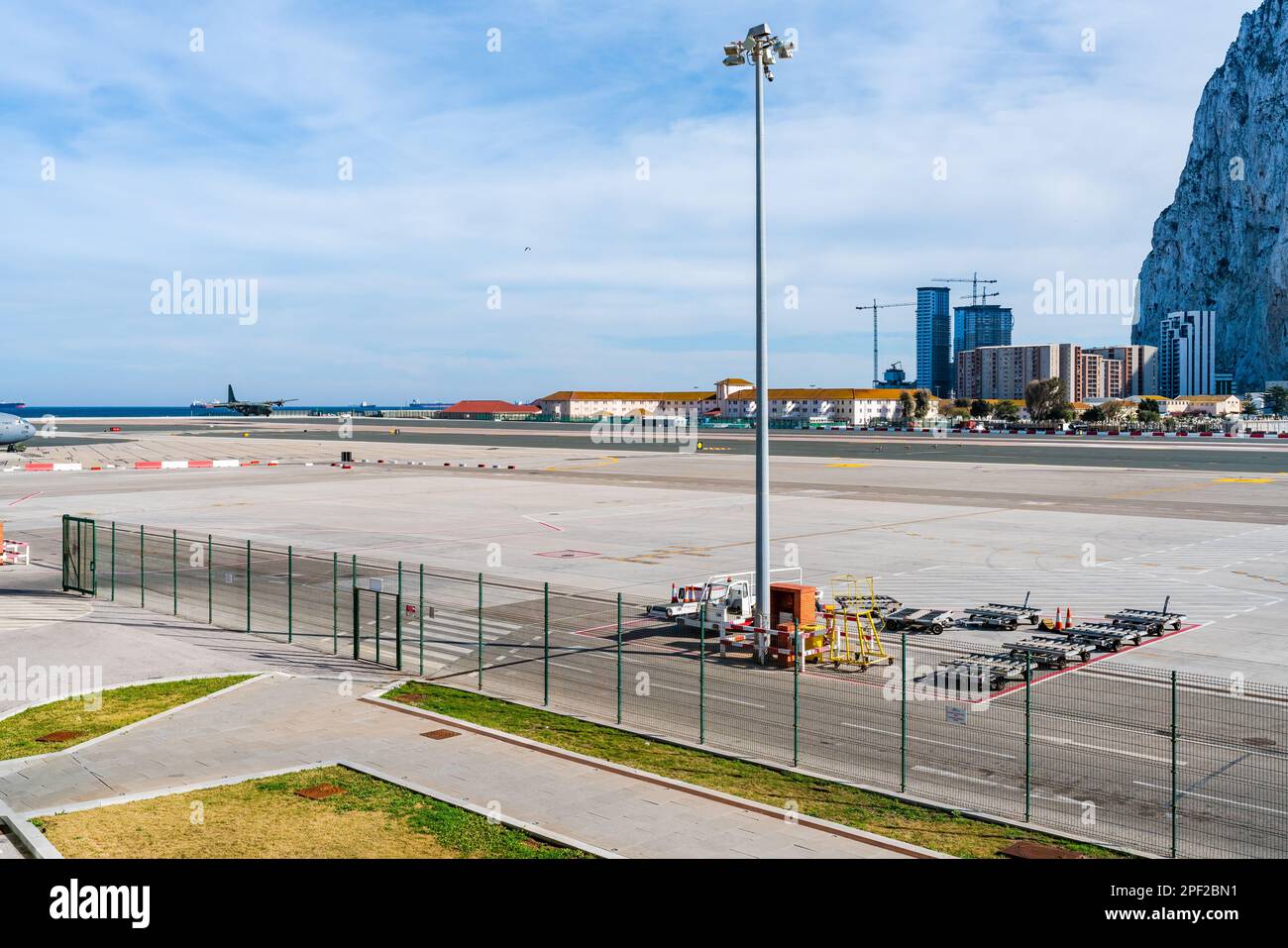GIBRALTAR, UK - MARCH 13, 2023: A plane lands at Gibraltar International Airport. Stock Photo