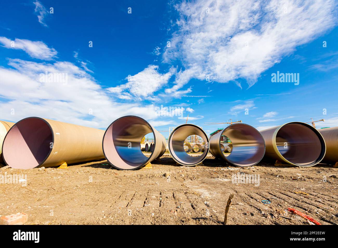 Many concrete pipes with durable ceramic glaze and large diameter for chemical waste are stacked waiting to built-in. Stock Photo
