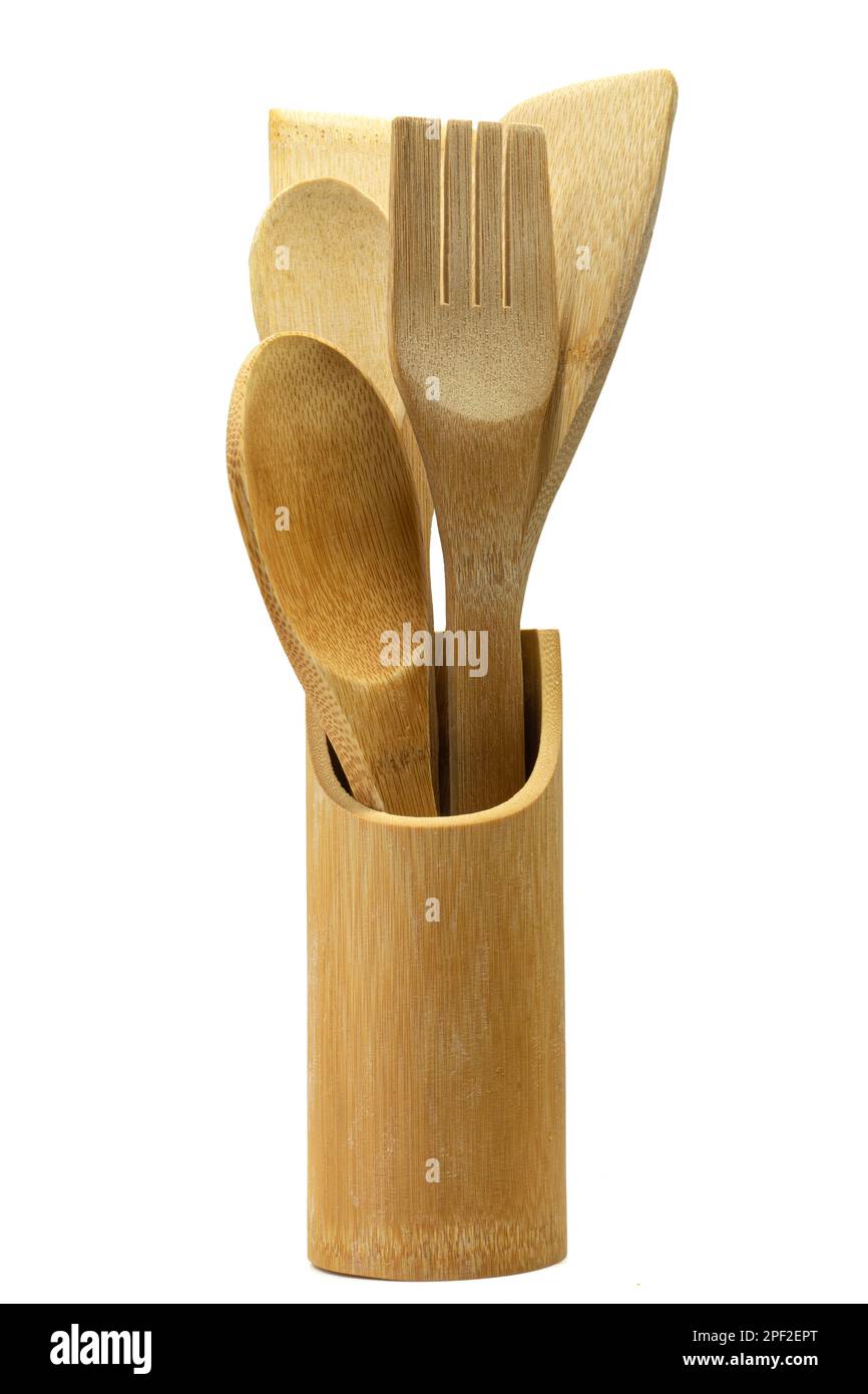 Set of wooden kitchen utensils in wooden jar. Traditional kitchenware made of wood Stock Photo