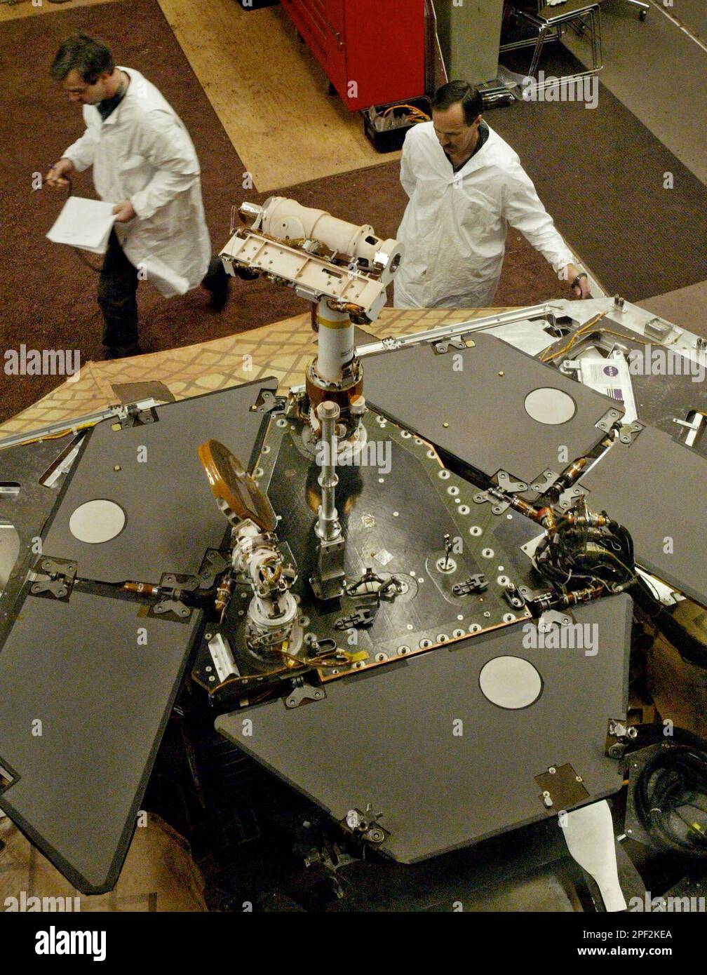 Testbed engineers Pete Darus, left, and Rick Graves perform tests using ...