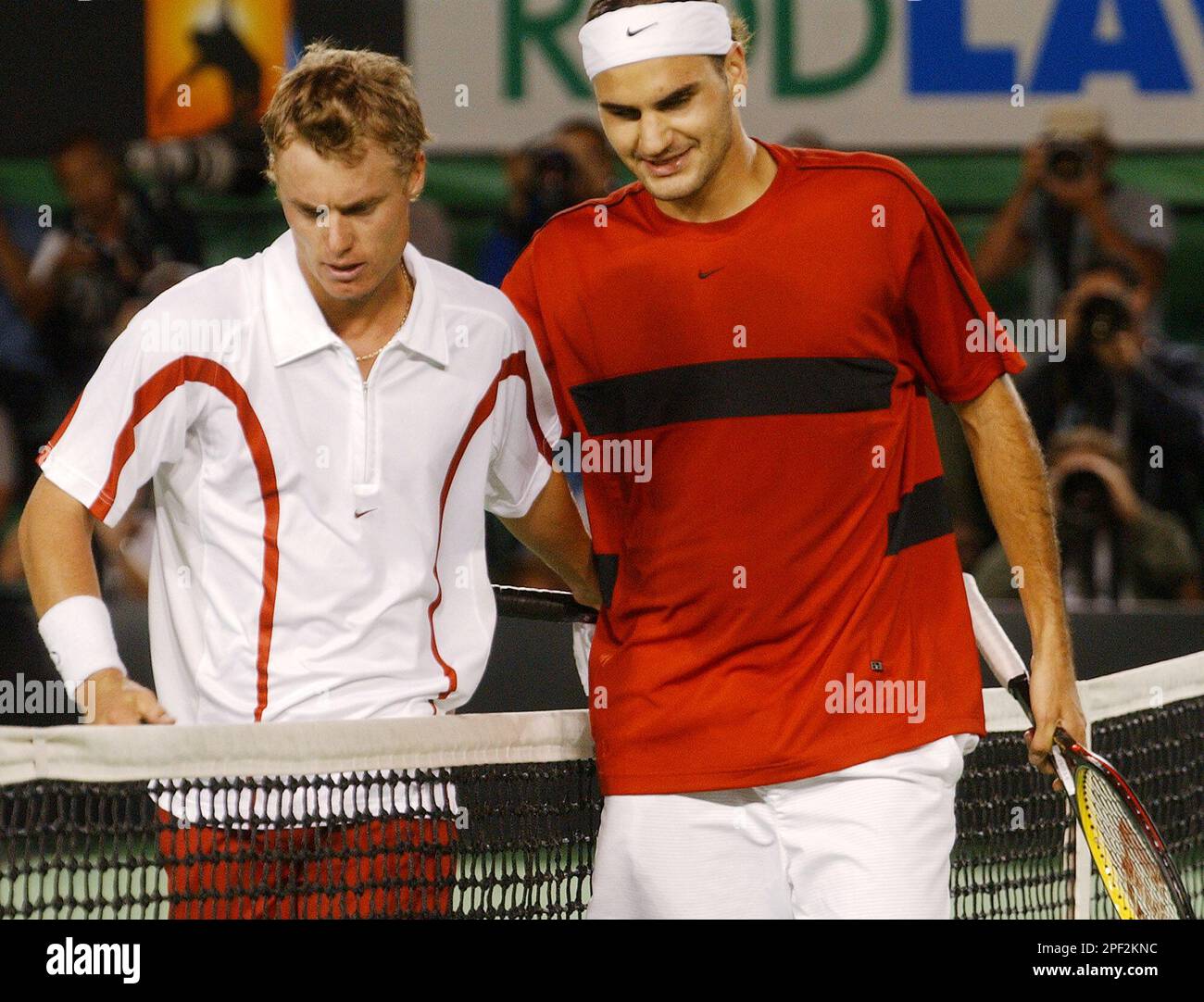 Switzerland's Roger Federer, right, is congratulated by Australia's Lleyton  Hewitt after their fourth round match at the Australian Open in Melbourne,  Australia, Monday, Jan. 26, 2004. Federer won in four sets 4-6