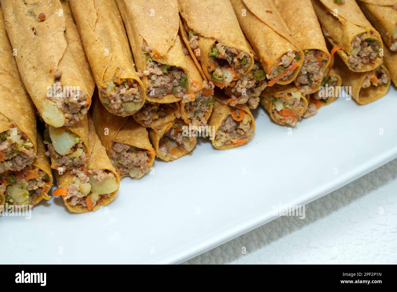 Authentic Mexican Beef Flautas on White Plate Stock Photo Alamy