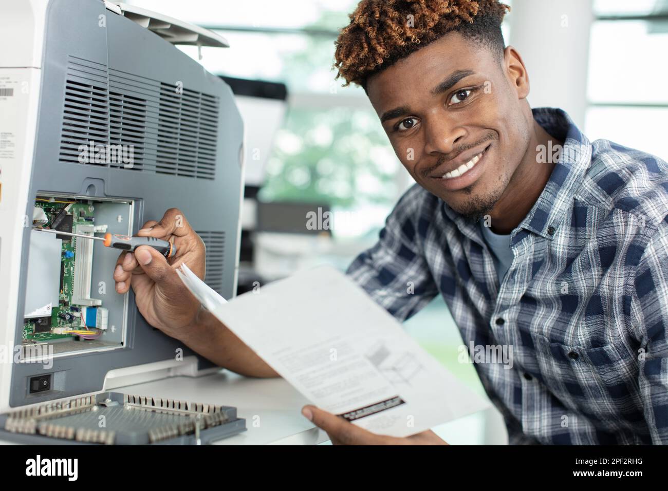 Shot black man fixing hi-res stock photography and images - Alamy