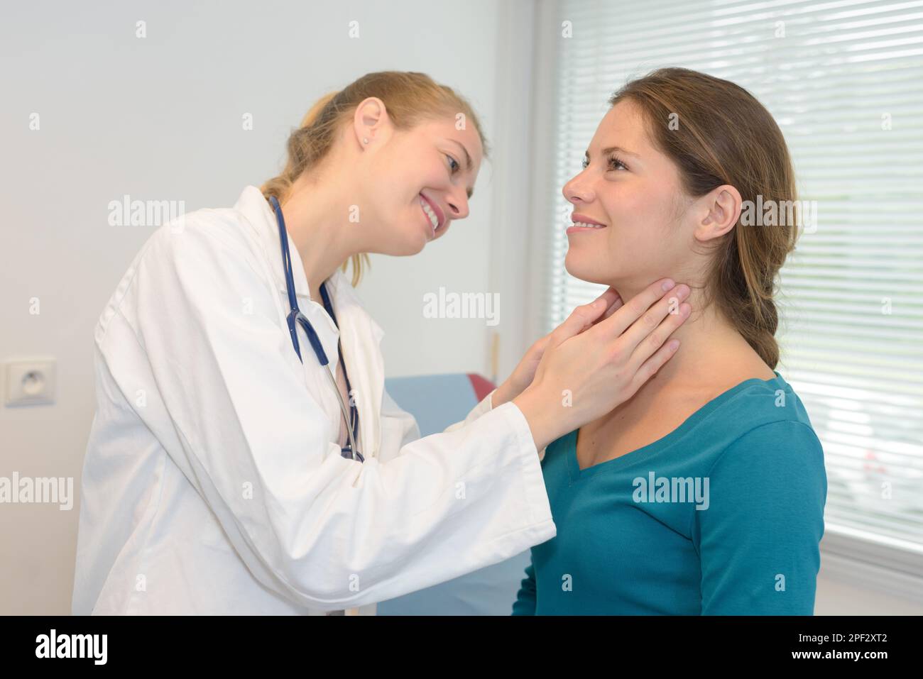 doctor checking females patient throat at the hospital Stock Photo Alamy