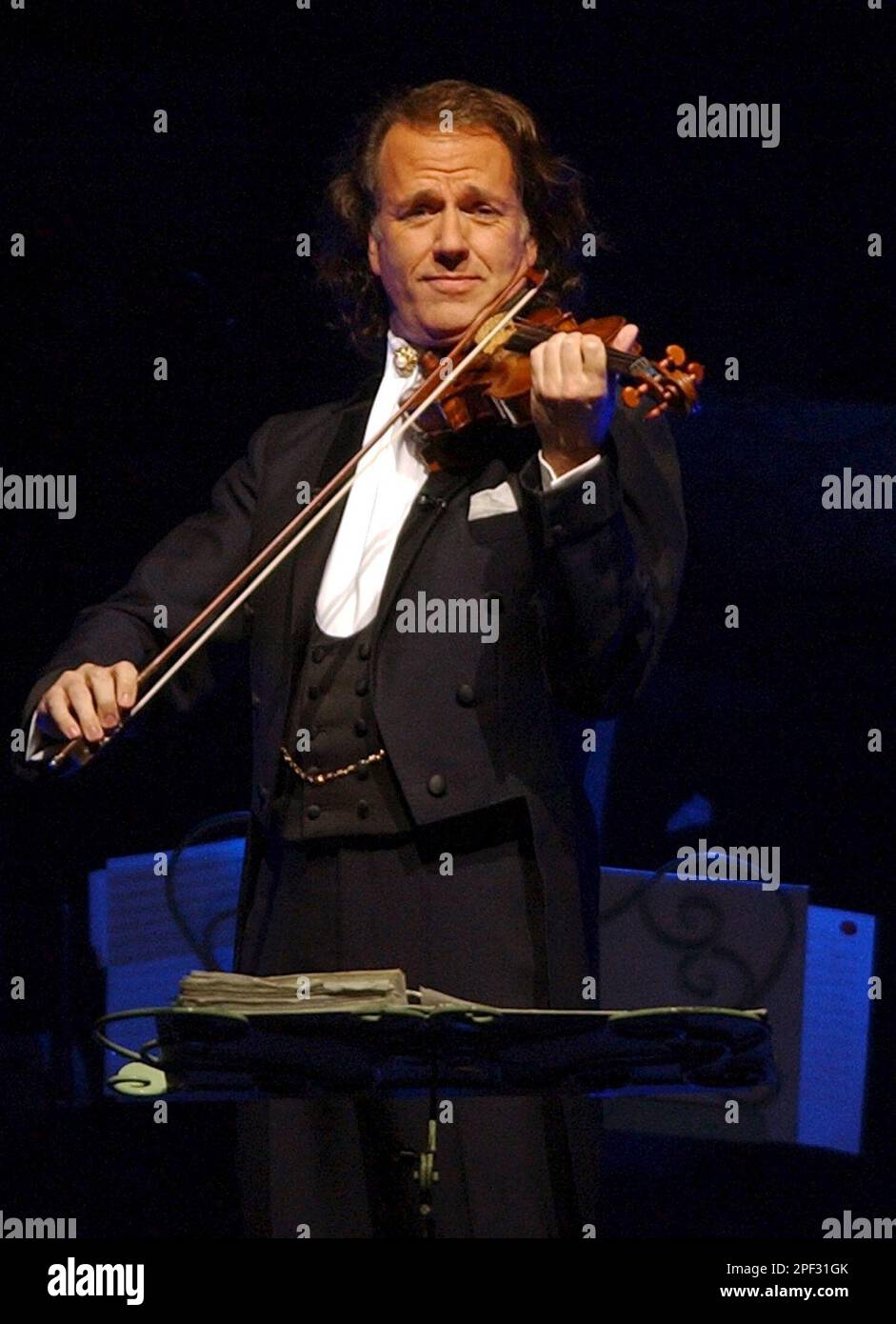 Dutch "pop" violinist Andre Rieu performs with his orchestra on stage