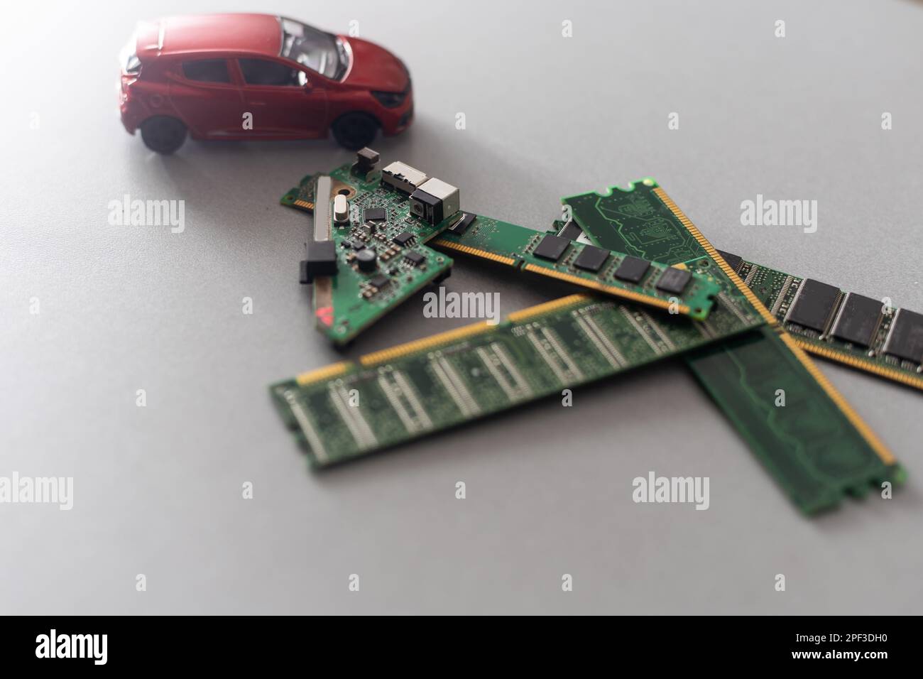 Toy cars on an electronic board with integrated circuits. The shortage