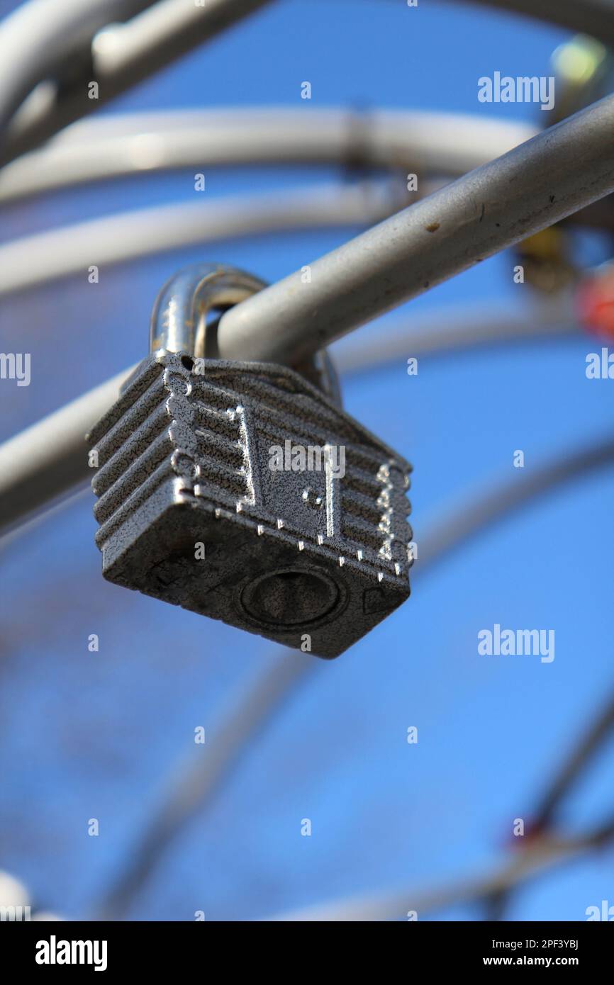 Newlyweds hang a lock as the symbol of eternal love Stock Photo - Alamy