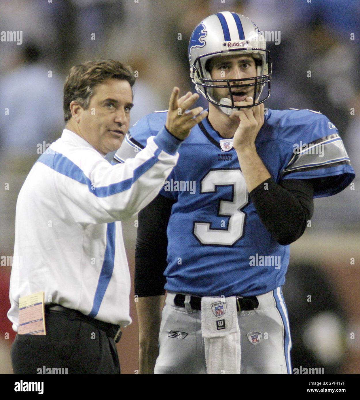 Detroit Lions head coach Steve Mariucci talks with quarterback