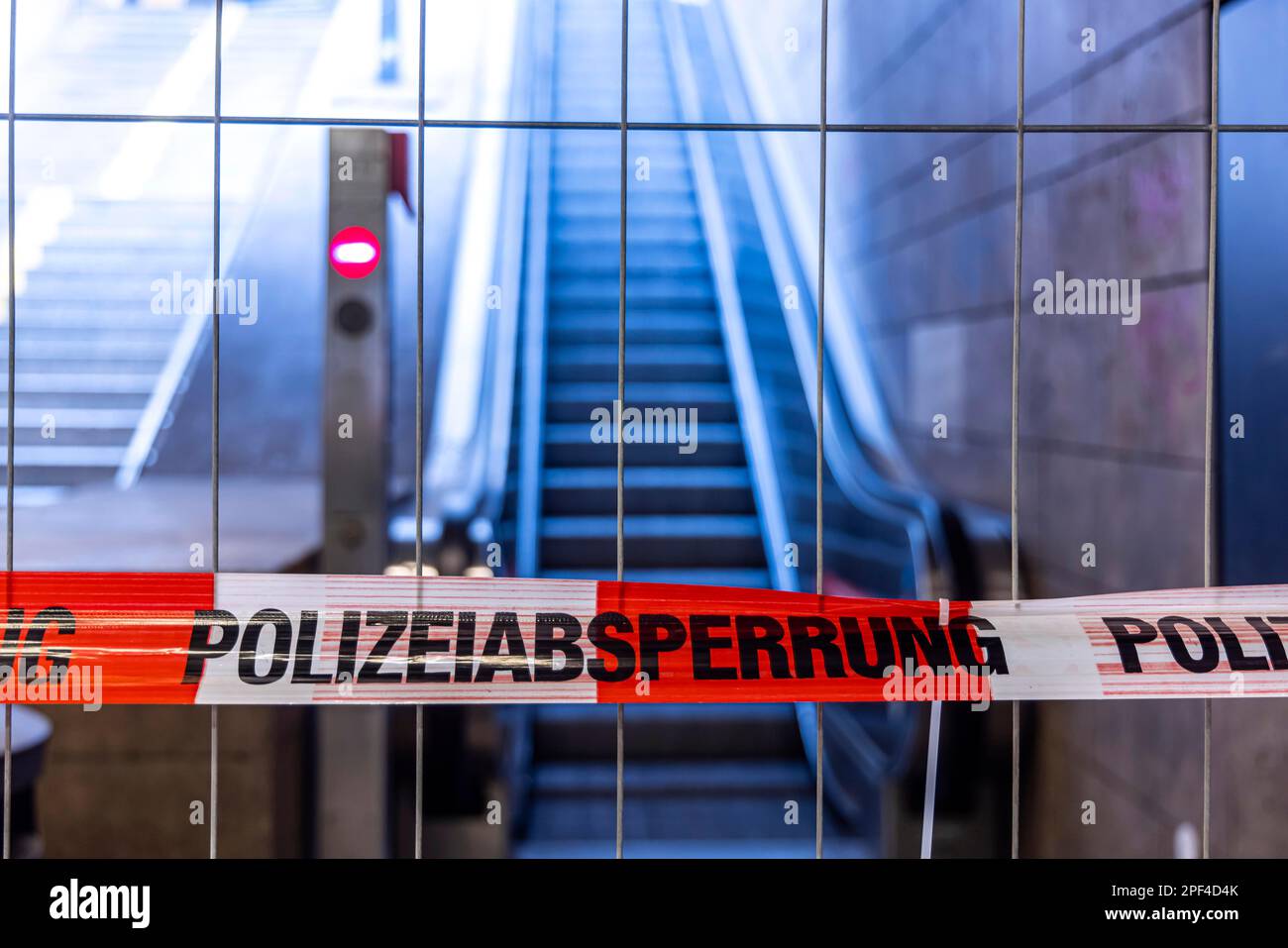 Police cordon. Flutter tape at the main station in front of an escalator, Stuttgart, Baden-Wuerttemberg, Germany Stock Photo
