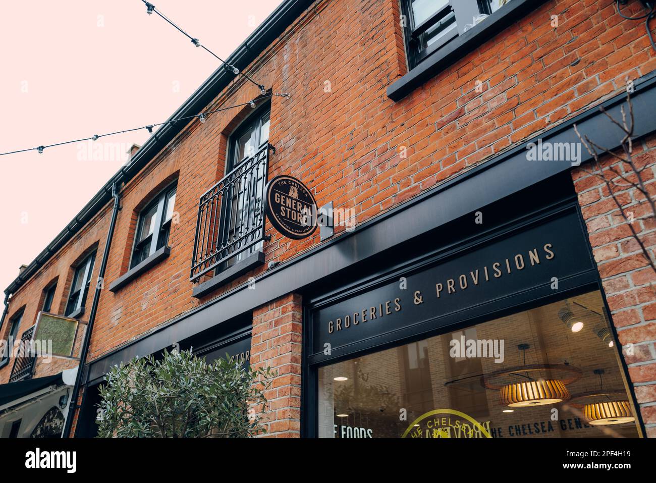 London, UK - February 21, 2023: Sign outside The Chelsea General Store on Pavilion Road in Kensington and Chelsea, an affluent area of West London fav Stock Photo