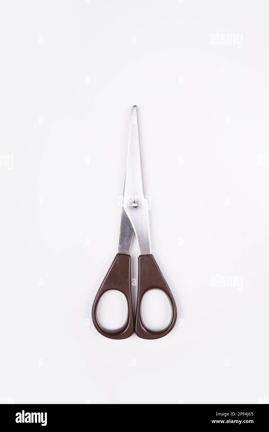 closed pair of household paper scissors on white background Stock Photo ...