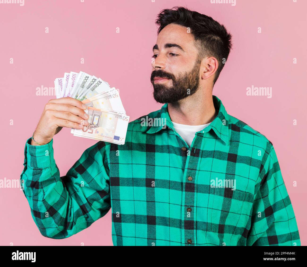 medium shot guy holding money. High resolution photo Stock Photo